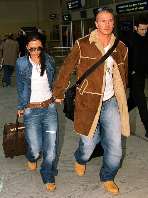 Victoria and David Beckham in matching Timberland's and jeans 2001 David And Victoria Beckham 2000s, David Beckham 2000 Style, David Beckham 2000s, David Beckham Jeans, David Beckham And Victoria, 2000s Hip Hop Fashion, David Beckham Family, David Beckham Style Outfits, Family Mansion