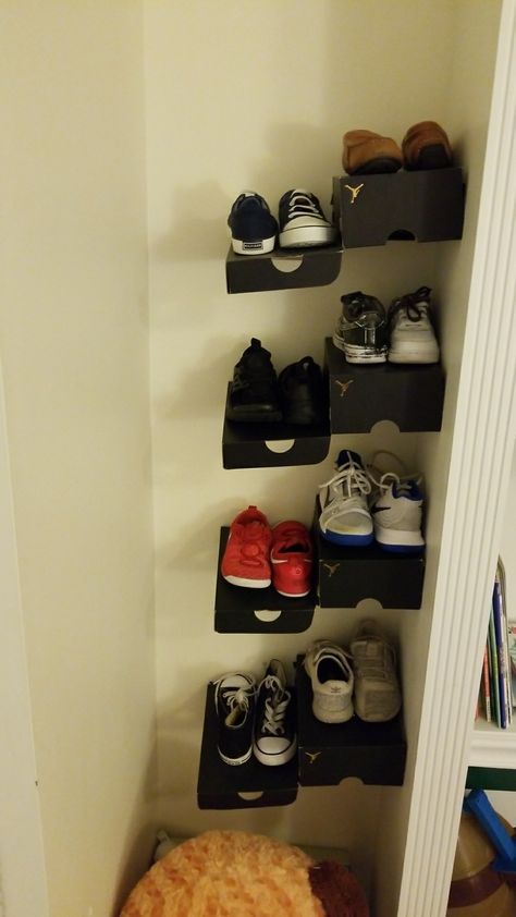 Repurposing shoe boxes DIY shoebox shelf for kids Shoe Box Stacking Ideas, Shoe Box Wall, Diy Shoe Display, Shoe Box Shelf, Shoe Box Display, Room Ideas Shoes Boxes, How To Put Your Shoe Boxes On The Wall, Shoebox Wall, Shoe Box Shelf Diy