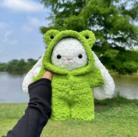 frog onesie bunny 🐸🤍 available on my etsy 🫧 onesie bunny pattern by me ☁️ tags 🏷️ #crochet #amigurumi #crochetbunny #amigurumibunny #crochetfrog #crochetplushie #crocheted Frog Onesie, Peach Plain, Crochet Onesie, Frog Crochet Pattern, Frog Crochet, Crochet Frog, Crochet Rabbit, Bunny Pattern, Crochet Clothing And Accessories