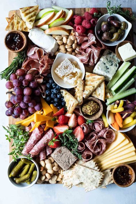 Learn how to build a charcuterie board for the ultimate snack dinner or party appetizer. My charcuterie board guide will coach you through how much meat and cheese to buy per person, how to assemble the most beautiful board, and the accessories you may want to add to fill in the gaps and add a flavor boost. Build A Charcuterie Board, Duck Pate, Thanksgiving Charcuterie, Chicken Liver Pate, Thanksgiving Cooking, A Charcuterie Board, Charcuterie Inspiration, Fruit Preserves, Copycat Restaurant Recipes