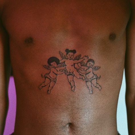 30 Beautiful Tattoos On Dark Skin | Tattoodo Afro Tattoo, Angle Tattoo, Black People Tattoos, Baby Angel Tattoo, Dark Skin Tattoo, Cupid Tattoo, Cherub Tattoo, Tattoos Mandala, Black Girls With Tattoos