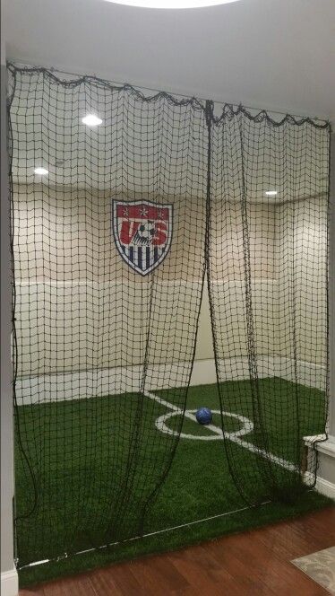 Basement soccer                                                                                                                                                                                 More Soccer Basement Ideas, Home Soccer Field Indoor, Indoor Soccer Field In Basement, Indoor Soccer Field In House, Soccer Bedroom Ideas For Boys, Basement Soccer Field, Boys Bedroom Ideas Soccer, Cool Basement Room Ideas, Boy Soccer Room