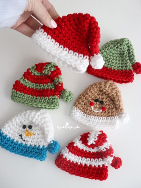 Here is a cute and quick holiday project that you can make in less than 30 minutes! These Mini Holiday Hats can be crocheted in many different color combinations and you can even stitch on a little face to create a gingerbread or snowman version. I personally love the candy cane stripes! Use them as … Crochet Elf Hat, Crochet Christmas Hats, Crochet Christmas Ornaments Free, Crochet Ornament Patterns, Crocheted Christmas, Repeat Crafter Me, Christmas Hats, Crochet Santa, Crochet Xmas