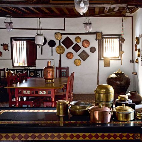 The kitchen is filled with old vessels that Kinnari sourced from the Sunday market in Ahmedabad and Chor Bazaar in Mumbai. “If the broken vessels have an interesting shape or history, I will buy them and fix them,” she says. Mata Ni Pachedi, Chor Bazaar, Radiantly Dressed, Chettinad House, Courtyard Wall, Usa Life, Indian Interiors, Indian Home Design, Ethnic Home Decor