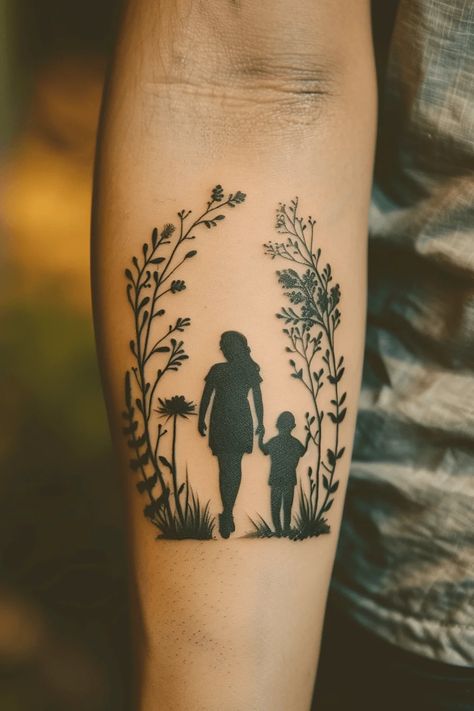 25+ Mother and Son Tattoo Ideas To Celebrate Your Special Bond Mom And Son Walking Tattoo, Mother Silhouette Tattoo, Mother And Son Tattoo Ideas Unique, Tattoo Mother And Son, Mom And Son Tattoo Ideas Simple, Mom Tattoo Designs For Son, Silouette Tattoo, Boy Mom Tattoo, Son Tattoo For Mom