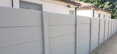 Smooth Stone Precast Concrete Fences & Walls | American Precast Precast Concrete Fence, Precast Fence Ideas, Concrete Fence Wall Design Ideas, Boundary Wall Design Exterior, Concrete Panel Facade, Concrete Fence Panels, Concrete Fences, Concrete Fence Wall, House Gates