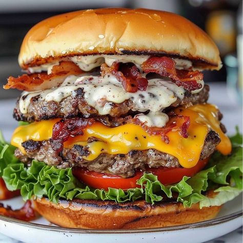 🍔🥓 One bite, and you'll be hooked! #CrackBurger #BurgerAddict 🍽️ Crack Burger 🛒 Ingredients: 1 lb ground beef 4 burger buns 4 slices cheddar cheese 4 slices bacon, cooked & crumbled 1/2 cup ranch dressing 1/4 cup cream cheese, softened 1 tbsp garlic powder 1 tbsp onion powder Lettuce & tomato for topping Salt & pepper to taste 👩‍🍳 Instructions: Prepare Burgers: Mix ground beef, garlic powder, onion powder, salt, and pepper. Form patties. Cook Patties: Grill or cook patties in a skillet un... Gormet Burgers, Pepper Bacon, Eating Food Funny, Food Burger, Food Addict, Bacon Burger, Tastemade Recipes, Cheese Burger, Beef Burgers