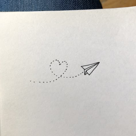 #paperplane #plane #draw #hand #heart #love #kiss #looping #gift #dessin #avion #papier #coeur #amour #bisou Plane Infinity Tattoo, Fine Line Paper Airplane Tattoo, Paper Air Plane Tattoo, Paper Aeroplane Tattoo, Paperplanes Tattoo, Paper Airplane Tattoos, Paper Plane Tattoo, Plane Tattoo, Meaningful Wrist Tattoos