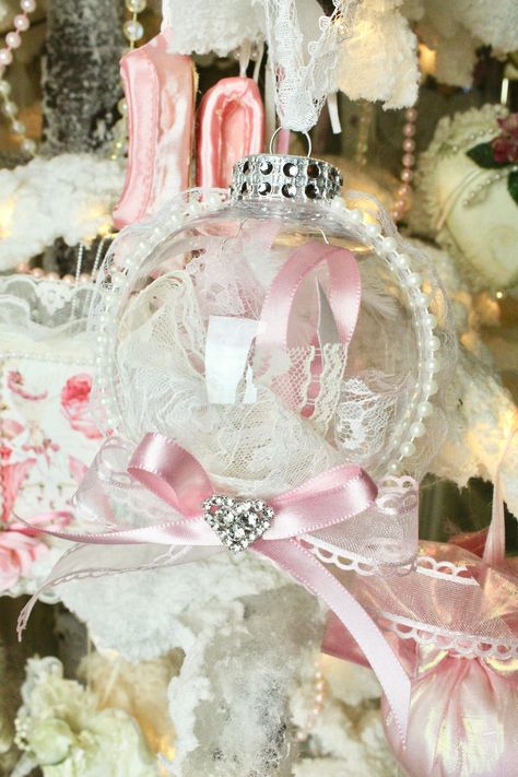 "Shabby Chic Christmas Tree Ornaments made with love..perfect for the holiday season or for all seasons home decor Shabby chic/Country cottage style All the ornaments are handmade by me The dainty ornament has vintage lace of different floral trims Vintage heart lace Trim for hanging Floral ruffle Lace around with faux pearls on front  Front Bow Pink Ribbons embellished with a heart rhinestone Inside the ornament it has Vintage Lace with pearls, beads and a white feather. Height: 4\" Width: Appr Coquette Ornaments, Bow Ornaments, Pink Victorian Christmas, Shabby Chic Ornaments, Lace Christmas Tree, Christmas Bazaar Crafts, Shabby Chic Christmas Tree, Victorian Christmas Tree, Pink Christmas Ornaments