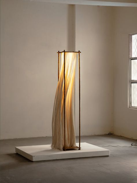 Sculptural sophisticated is balanced with inviting warmth in the impeccable Ito modern floor lamp. Its structured profile is crafted with rich cast brass that shows off subtle texture and dimension and complemented with the ethereal softness and warmth of flowing cotton. Light filters through to create an inviting glow, perfect for a refined but relaxed sitting area. Features: Ethereal beauty and softness contrast a structured frame Light glows through soft cotton to create an ephemeral glow in a cozy sitting area Cast brass frame offers a classic cuboid structure Stunning in a curated living space that balances sophistication with alluring informality Handcrafted in India Designed by STEM, Limited Edition Lead time approximately 6-8 weeks Measurements: Dimensions (in): W13.8" x D13.8" x H Contemporary Lamp, Stem Design, Light Sculpture, Modern Floor Lamps, Diy Lamp, Subtle Textures, New Media, My Account, Contemporary Interior