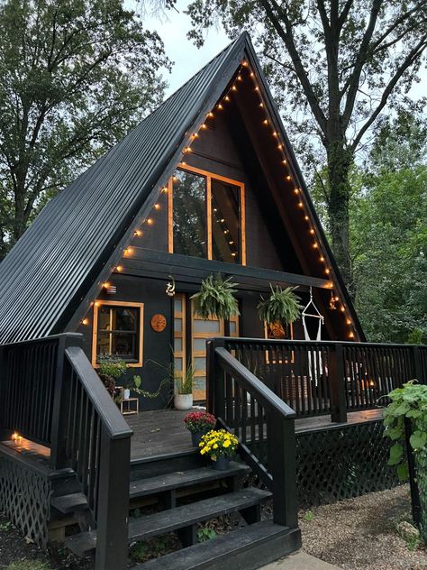 She Went From Life as a Nomad to an A-frame Cabin A Frame Cabin Stairs, A Frame With Porch, A Frame House With Garage Underneath, Moody A Frame, A Frame House Colors Exterior, One Bedroom A Frame House Plans, Building An A Frame Cabin, A Frame Metal Roof, Simple A Frame House