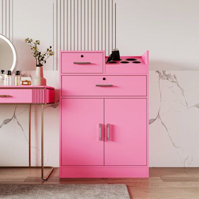 With its modern and sleek design, our cabinet is not just a storage solution but also a stunning statement piece that will elevate the overall look of your home. Invest in quality and style with our exceptional cabinet. Color: Pink | Ebern Designs Locking Beauty Salon Storage Cabinet | Wayfair Beauty Salon Storage, Salon Storage, Vertical Storage Cabinet, Bedroom Toilet, Beauty Cabinet, Beauty Station, Cabinet Top, Salon Stations, Desk Cabinet