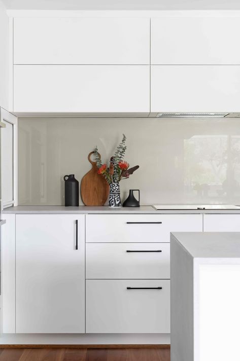 You can't go wrong with neutrals. Keeping it clean and fresh with @polytec cabinetry in Crisp White and DWG Glass splashback in Frothing Mocha, this versatile kitchen is bright and modern. Choosing bright neutrals in your kitchen creates the illusion of a bigger, more open space, while our minds associate white kitchens to feel cleaner. @caesarstoneau benchtops in Airy Concrete are the finishing touch on this perfectly neutral kitchen. Glass Splashback Kitchen, Splashback Kitchen, Kitchen 2024, Craftsman Kitchen, Neutral Kitchen, White Kitchens, Dream Kitchens Design, Kitchen Organisation, Kitchen Splashback