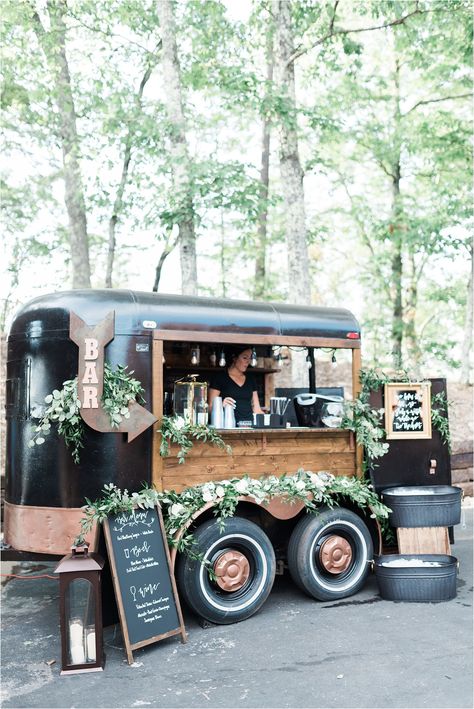 Anyone up for a stunning mobile bar? We love this greenery decor that adorns this black bar trailer from Single Barrel Events. Need to take wedding day drinks anywhere? A roaming bar is where it's at! This black and white wedding in the Smoky Mountains is also worth viewing. Photos from Leah Nicole Photo | The Magnolia Venue www.themagnoliavenue.com #mobileweddingbar #weddingdaydrinks Mobile Bar Cart, Gerobak Dorong, Mobile Cocktail Bar, Lovely Letter, Mobile Coffee Shop, Coffee Trailer, Caravan Makeover, Travel Bar, Smoky Mountain Wedding