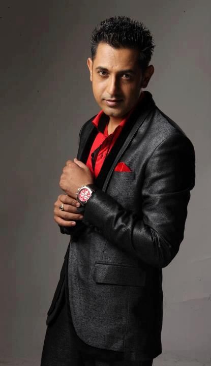 Gippy Grewal looking handsome in shimmering black blazer with red accent shirt and handkerchief Babbu Maan, Gippy Grewal, Punjabi Movies, Richest Actors, Punjabi Music, Punjabi Singer, Punjabi Fashion, Songs Download, Comedy Film