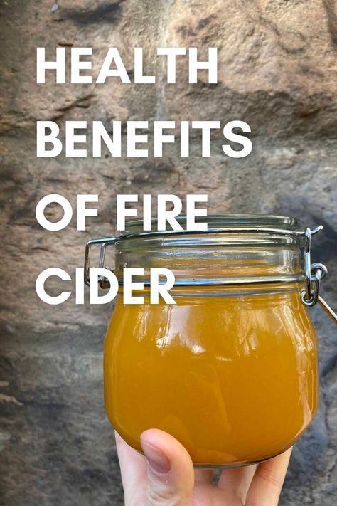 A person holding a jar of fire cider. Fire Cider Benefits, Fire Cider Recipe, Apple Benefits, Garlic Benefits, Fire Cider, Cider Recipe, Health And Fitness Magazine, Cold Prevention, Natural Sleep Remedies