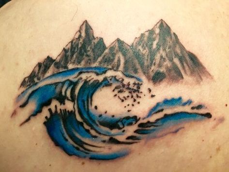 Elevate your style with mountain tattoos. In this article, we will share the best designs from geometric lines to realistic depictions. Mountain Waves Tattoo, Mountain And Waves Tattoo, Waves Tattoo Ideas, Waves And Mountains Tattoo, Mountain And Beach Tattoo, Mountain And Wave Tattoo, Mountains And Ocean Tattoo, Mountain And Ocean Tattoo, Croatia Tattoo