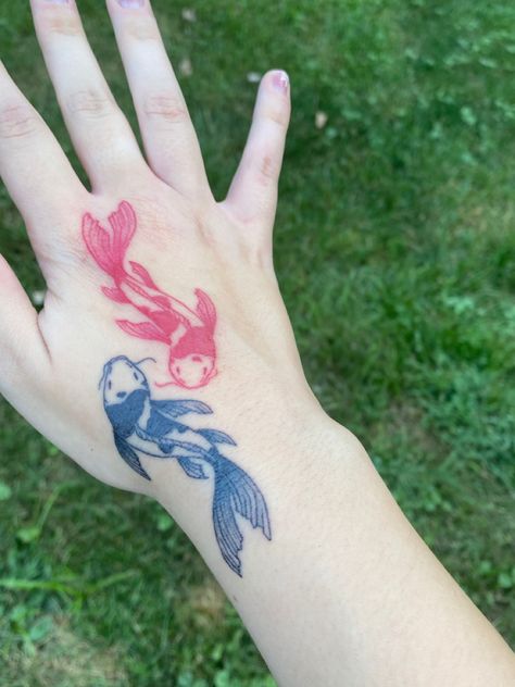 Koi Fish Tattoo On Hand, Koi Hand Tattoo, Black And Red Koi Fish Tattoo, Red And Black Koi Fish Tattoo, Colored Koi Fish Tattoo, Koi Fish Hand Tattoo, Fish Hand Tattoo, Red Koi Fish Tattoo, Yin Yang Koi Fish Tattoo