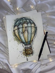 Small Painting Watercolor, Watercolor Hot Air Balloon Painting, Watercolor Painting On Book Pages, Hot Balloon Drawing, Watercolor And Fineliner Art, Watercolor Art Ideas Sketchbooks, Watercolour Art Aesthetic, Hot Air Balloon Sketch, Aesthetic Watercolor Art Ideas