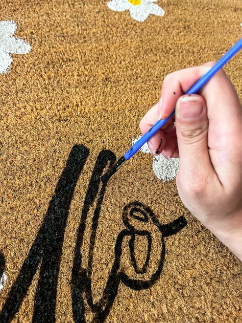 How to Make Your Own Doormat Using Acrylic Paint - Simply Secen How To Paint A Doormat Diy, Diy Personalized Doormat, Painting An Outdoor Rug, How To Paint A Rug Porch, Outdoor Rugs Diy, Diy Painted Fall Doormat, Sip And Paint Halloween Door Mat, How To Paint An Outdoor Rug, Painting A Rug Diy