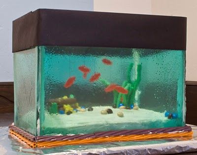 Aquarium cake!  How in the world?  Sheets of melted candy I bet for the glass and the fish hanging from the top.  Oh how fun is that? Aquarium Cake, Unbelievable Cakes, Tank Cake, Sugar Glass, Edible Crafts, Crazy Cakes, Cake Boss, Unique Cakes, Novelty Cakes