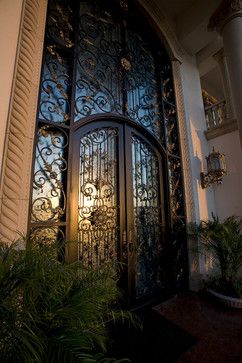 Ornate wrought iron and carved stone Mediterranean front entrance | Sweany Custom Homes       ᘡղbᘠ Wrought Iron Doors, Tuscan Decorating, Iron Door, Front Entrance, Iron Gates, Mediterranean Homes, Front Entrances, Carved Stone, Door Ideas