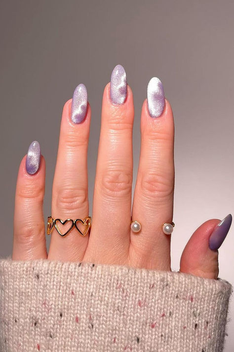 Delicate lavender and silver cat eye nails with charming subtle heart designs, perfect for a romantic touch this Valentine's Day! 💜✨ // Photo Credit: Instagram @katiesnails_ Cat Eye Spring Nails, Nails Ideas Cat Eye, Pastel Cat Eye Nails, Spring Cat Eye Nails, Lavender Cat Eye Nails, Summer Cat Eye Nails, Heart Cat Eye Nails, Sparkly Valentines Nails, Silver Cat Eye Nails