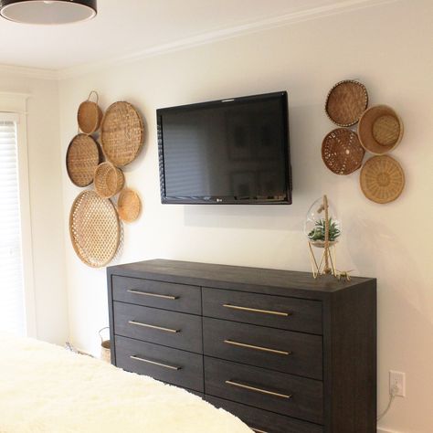 Wall baskets on tv wall. Alabaster White Wall and trim. Baskets Around Tv On Wall, Baskets Around Tv, Wall Baskets Around Tv, Basket Wall Above Tv, Basket And Picture Wall, Basket Wall Around Tv, White Wall And Trim, Basket Wall Bedroom, Boho Tv Wall Decor