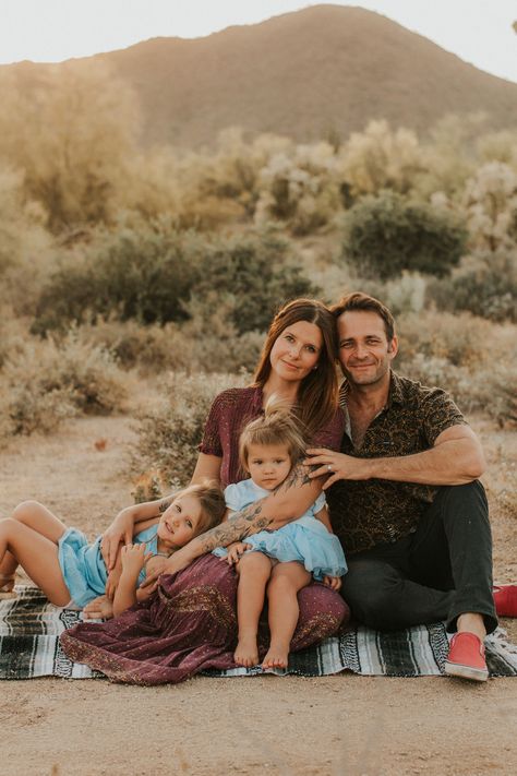 Desert family photos Desert Family Portraits, Family Photo Poses Desert, Family Pictures Sitting On Blanket, Family Photos In The Desert, Desert Photoshoot Ideas Family, Desert Christmas Photo Shoot, Desert Family Photos Outfits, Family Desert Photoshoot, Desert Family Pictures