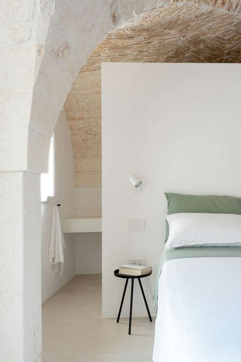 Photo 10 of 18 in A Refined and Delicate Renovation Primes a Historic Puglia Apartment - Dwell Spain Bedroom, Limestone Floor, Antonio Lopez, Italy House, Limestone Flooring, House Floor Design, Concrete Floor, Wall Finishes, Bed Wall