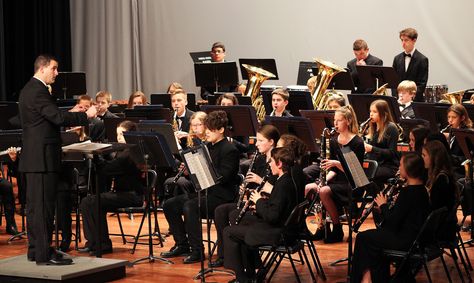 Associate Band Director Andrew Buttermore directs a song during the Ames High School band holiday concert Monday evening at the high school auditorium. Another school music concert this week is the joint Mitchell and Sawyer elementaries chorus concert at 6 p.m. on Thursday at Ames Middle School. Photo by Sarina Rhinehart/Ames Tribune High School Concert Band Aesthetic, Band Class Aesthetic, Band Director Aesthetic, High School Band Aesthetic, School Band Aesthetic, Band Aesthetic High School, Sophomore Year High School, Band High School, Band Boyfriend