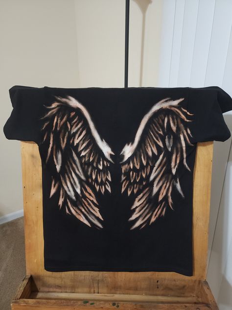 This one of a kind creation is a black t-shirt, hand painted with bleach.  **Please message before buying.** Make sure to leave details on which design you are interested in. I can do almost any theme, so if you are interested in this design or something similar please let me know. The normal time frame for you to receive the shirt is between 2 to 3 weeks.  Shirts will be washed and dried after bleaching, please let me know if you have any sensitivity to laundry detergent. Bleach Painting Tshirts, Black Bleached Shirt Diy, Bleaching Black Shirts, Black Bleached Shirt Design, Bleach Painting Designs, Custom Bleach Hoodie, Simple Bleach Shirt Ideas, Bleaching T Shirt, How To Dye Clothes Black