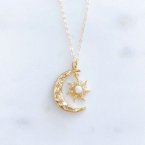 "DESCRIPTION: The AURORA Necklace - Gold crescent moon + opal sun pendant on a dainty gold filled chain. Wear it on its own for a celestial statement or layer it up with your favorite necklaces, either way your going to want to wear this beauty again and again. We love this celestial necklace and think you will too! MATERIALS: Chain, clasp, and jump rings - Gold filled Pendant - Gold plated, Opal, CZ stones PENDANT SIZE: Approximately 1\" in length PACKAGING: Your necklace will arrive on a Daint Sun And Moon Necklace Aesthetic, Moon Gold Necklace, Moon And Sun Necklace, Sun And Moon Jewelry, Sun Moon Necklace, Aurora Necklace, Opal Moon Necklace, Ethereal Jewelry, Celestial Pendant