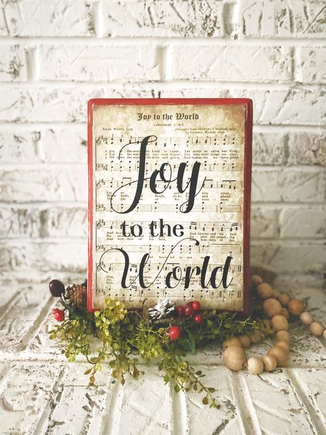 "If you are looking for Christmas farmhouse decor, this Joy to the World \"sign, makes the perfect item for individuals that love classic, vintage hymns and decorating for the Christmas season. Our pieces are made of real wood, hand painted and distressed. We add black wording to each hymn sheet to signify an important section of each particular hymn. Each sheet is preserved using the best quality matte finish sealer. The delicate preservation process insures each customer enjoys their hymn shee Rustic Farmhouse Christmas, Christ Centered Christmas, Jesus Birthday, Christmas Church, Christmas Signs Wood, Christmas Wood Crafts, Rustic Christmas Tree, Christmas Door Hanger, Christian Christmas