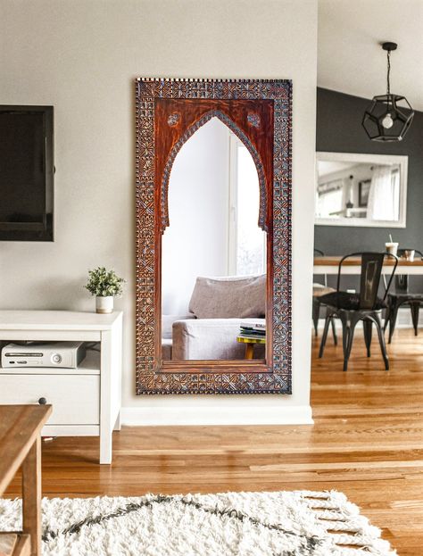 Welcom To Our Store "Moroccan Touch MA"; Add a touch of Moroccan charm to your home with this beautifully crafted Large Mirror. Made from high-quality cedar wood, this vintage style mirror frame features intricate hand-carved details that are sure to impress. The frame is the perfect size for displaying in your entryway, bedroom, or living room, and the warm wooden tones will complement any decor. Whether you're looking for a unique gift or a statement piece for your own home, this Moroccan mirror frame is a must-have. The design of this wall decor is inspired by the window and door arches which were used in olden days in Morocco. All our products are made by our craftsmen in Morocco. Each piece is handmade and it takes a lot of time and effort to make one piece. Our products are not perfe Hand Carved Wall Mirror, Full Length Mirror Decor Ideas, Vintage Wood Mirror, Vintage Mirror Wall Decor, Moroccan Mirror Wall, Moroccan Wall Decor, Vintage Style Mirror, Arch Wall Mirror, Moroccan Interior Design