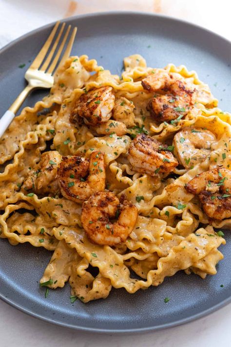 Spice up your dinner with this irresistible Cajun Shrimp Scampi! This Spicy Shrimp Scampi Recipe combines succulent shrimp with zesty Cajun seasoning for a flavor explosion. Perfectly paired with pasta, this dish offers a creamy, bold twist on classic scampi. Whether you're looking for a weeknight dinner or something to impress guests, this Easy Cajun Shrimp Scampi is sure to become a favorite. Get ready to enjoy a meal that's both delicious and exciting! Cajun Shrimp Scampi, Italian Seafood Stew, Scampi Sauce, Shrimp Scampi Pasta, Comfort Pasta, Italian Seafood Recipes, Cajun Shrimp Pasta, Homemade Cajun Seasoning, Creamy Pasta Recipes