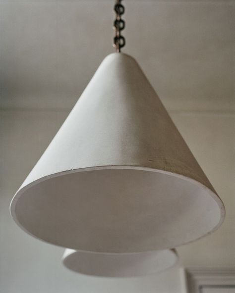 Rose Uniacke on Instagram: “A 1940’s Cone light designed by Syrie Maugham hanging in Rose’s kitchen. We have made a cone lamp for our editions range in honour of this…” Rose Uniacke Lighting, Plaster Pendant Light, Plaster Lighting, Copper Hanging Lights, Mid Century Lights, Cone Lamp, Rose Uniacke, Designer Lighting, Ceramic Pendant Light