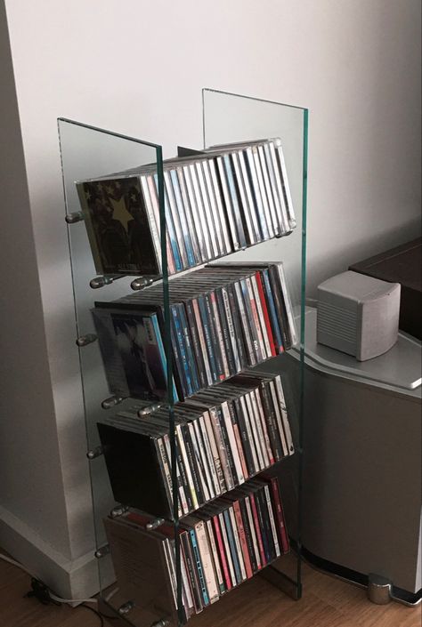 Icarly Room Aesthetic, Creative Cd Storage, Dvd Astethic, Movie Shelf Aesthetic, Cds Wall Decor, Ways To Display Cds, How To Display Cds, Cd Shelf Aesthetic, Cd Player Set Up