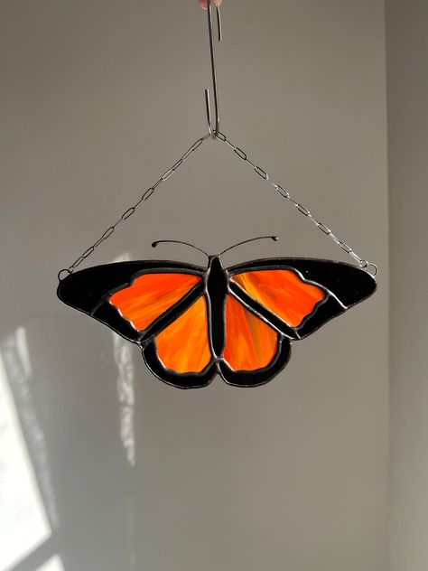 A monarch butterfly handcrafted in stained glass by myself, Shannon, of Wonder Filled Glass :) I use the copper foil method and lots of love to create my pieces. This piece is my minimalist take on this species. Thank you for stopping by and viewing my art!  Follow me on Instagram and TikTok to see the handmaking process and any new pieces @WonderFilledGlass <3 The butterfly is 9 inches wide & stands about 4.5 inches tall (including the antennae). The length from the top of the chain to the bott Butterfly Stained Glass Art, Stained Glass Butterfly Pattern, Butterfly Stained Glass Pattern, Monarch Stained Glass Pattern, Simple Butterfly Stained Glass Pattern, Moth Stained Glass Pattern, Glass Art Window, Stained Glass Monarch Butterfly, Moth Stained Glass Window