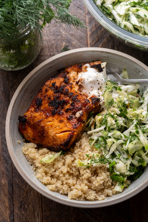 These Honey Harissa Salmon Bowls are loaded with fluffy quinoa, smoky broiled salmon and served with a fresh herby cabbage slaw and a dollop of yogurt. Hearty, healthy and ready in under 30 minutes. Healthy Easy Bowl Recipes, Mediterranean Salmon Quinoa Bowl, Salmon And Beans, Salmon And Chickpeas, High Protein Salmon Bowl, Salmon Healthy Meals, 75 Soft Recipes, Bbq Salmon Bowl, High Protein Bowls