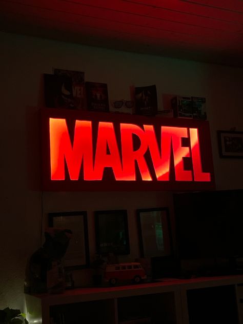 Marvel sign self made deco if the marvel logo in led Marvel Shelf Ideas, Marvel Fan Aesthetic Room, Red Room Marvel Aesthetic, Marvel Aesthetic Room, Aesthetic Marvel Room Decor, Marvel Shelf, Marvel Sign, Marvel Bedroom Decor, Marvel Room Ideas