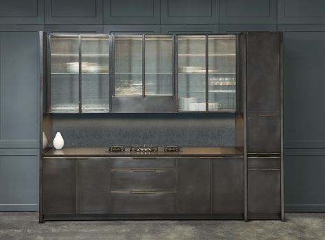 Warm Gunmetal Kitchen by Amuneal This expansion on Amuneal’s kitchen collection adds a hand-patinated gunmetal finish in stainless steal to the offering. Fine metalwork frames clear or ribbed glass door fronts. The collection also includes new and custom-machined cabinet pulls. See it at: ICFF, Booth #445 Ribbed Glass Door, Gunmetal Kitchen, Vintage Popular Mechanics, Metal Kitchen Cabinets, Kitchen Science, Upper Kitchen Cabinets, Garden Cooking, Bespoke Kitchen, Popular Kitchens