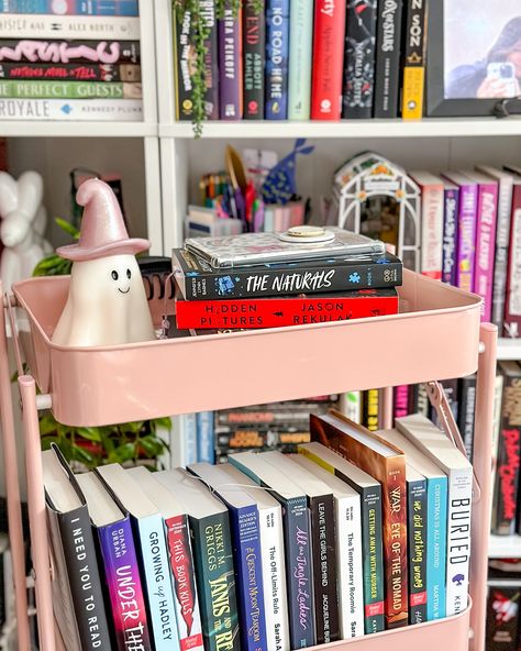 tbr cart 📚🛒 finally found a cute cart (+ cute ghost) and now I have more space for books! I was running low on space, so I’m glad I found this haha. basically it’ll just have my line up rotating through 💖 I have been working through my physical tbr like crazy and trying to slim it down! while I have put a good dent in it…it’s also gone up to 120 😭😂 I’ll get there one day…right??? 💬 - how many books are on your physical tbr? or not physical if you only read ebooks? Tbr Cart Aesthetic, Tbr Cart, Slim Bookshelf, Book Corner Ideas Bedroom, Book Carts, Bookish Aesthetic, Bookshelf Inspiration, Book Cart, Corner Ideas