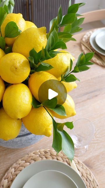 Carol & Ale on Instagram: "Unique Lemon Centerpiece Idea 🍋🍋 how perfect is this arrangement for Spring / Summer?? It’s so easy to make and it looks SO beautiful!  You just need barbecue skewers, lemons and your favorite greenery! Comment LINKS and I can send you a DM with the links to everything I used (including this beautiful vase)  Let me know if you make it!  #partyideas #centerpiece #centerpiecesideas #centerpieceideas #partydecor #springdecor #springdecorating #summerdecor #summerdecorating #tablescapestyling #tablescapetuesday #tablescapeideas #floralarrangement #homeblogger #pinterestinspired" Decor With Lemons Ideas, Lemon Arrangements Vases, Lemon Vase Centerpiece, Lemon Flower Arrangements, Lemon Centerpiece Ideas, Decorating With Lemons, Easy Diy Centerpieces, Spring Centerpiece Ideas, Floral Table Centerpieces