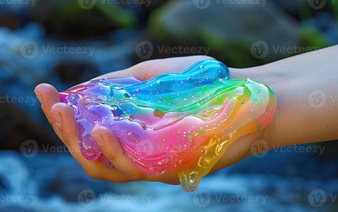 Rainbow glitter slime held in a hand Rainbow Slime, Glitter Slime, Wedding People, Heart Tree, Cityscape Photos, Rainbow Glitter, Logo Banners, Nature Backgrounds, Heart With Arrow