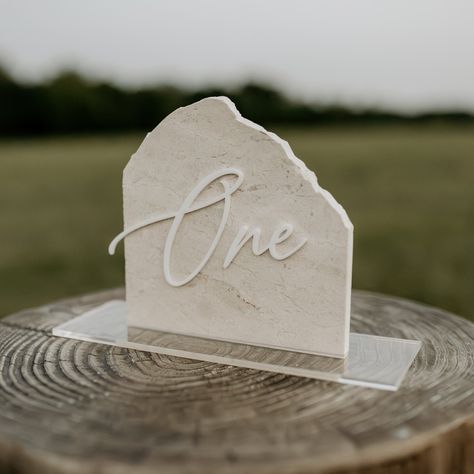 ✨ some of the gorgeous marble signage we’ve been working on lately ✨ - uv printed with lasercut 3D acrylic lettering - comes in 3 stunning colors - variety of sizes and bases available… from 6x6” to 11x12” 🫶🏼 Rustic Natural Wedding Decor, Marble Table Numbers, Marble Signage, Stone Table Number, Stone Table Numbers, Natural Stone Table, Wedding Seating Chart Display, Neutral Wedding Decor, Diy Table Numbers