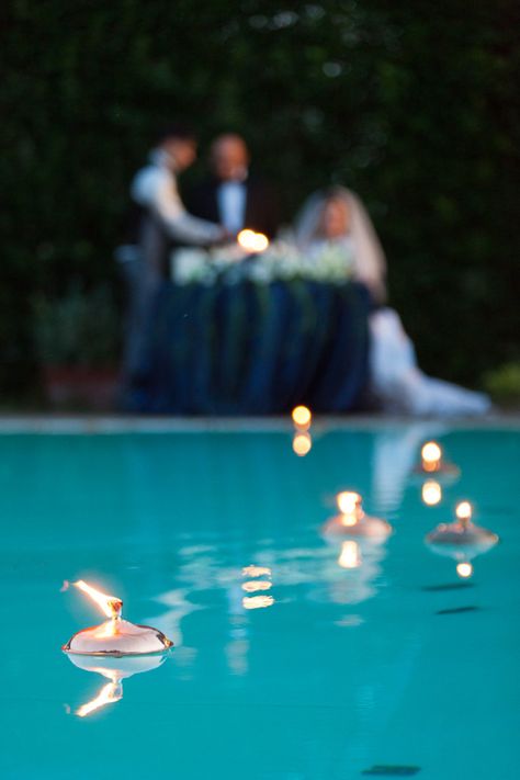 A gorgeous decoration for a poolside wedding reception is candles floating in the pool. #TheTuscanWedding Poolside Wedding Ceremony, Poolside Wedding Reception, Floating Pool Candles, Backyard Wedding Pool, Pool Candles, Poolside Wedding, Candles Floating, Fox Wedding, Pool Wedding