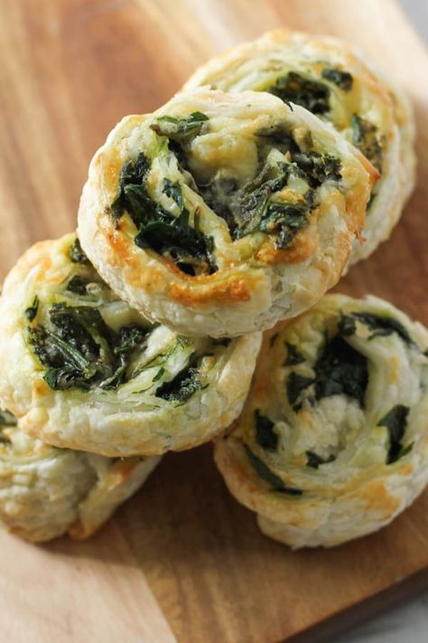 Spinach and Feta Pinwheels made from puff pastry and fresh spinach are great for easy snacks or an appetiser for parties.  These vegetarian spinach and feta scrolls are always a hit with kids and adults alike.  These pinwheels can be made in the oven or the air fryer, and they freeze well, so make a big batch and reheat when you're ready.   #pinwheels #spinachfetapinwheels Spinach And Feta Pastry Rolls, Air Fryer Spinach Recipes, Air Fryer Pinwheels, Air Fryer Puff Pastry Recipes, Feta Pinwheels, Spinach Appetizers, Spinach Roll Ups, Spinach Puff Pastry, Spinach Puff