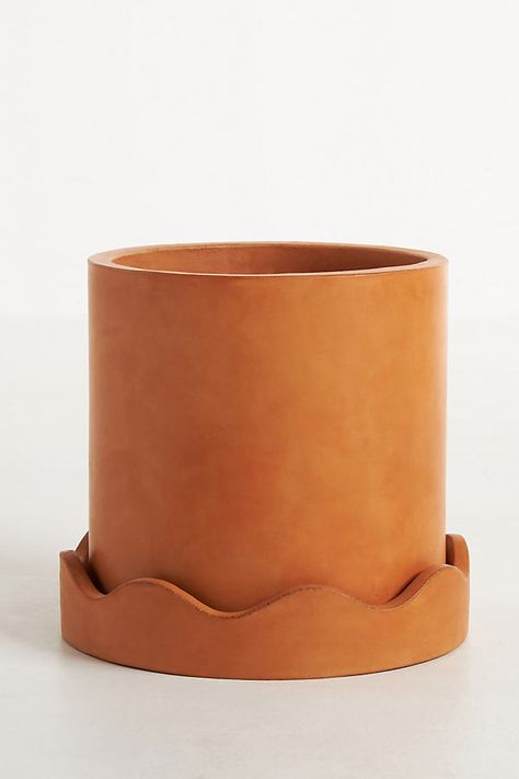 We love some playful squiggles, and the Scalloped Terracotta Pot incorporates this trend-forward look perfectly. Made from cement with a terracotta hue, this fun and functional planter can be used indoors or outdoors. | Scalloped Terracotta Pot by Anthropologie in Brown, Size: Small Clay Planter, Terra Sigillata Ceramics, Anthropologie Ceramic, Cool Pottery, Terracotta Diy, Plant Pot Indoor, Mid Century Modern Planter, Terracotta Pottery, Planter Project