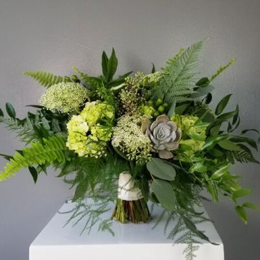 A gorgeous garden styled bouquet featuring a blend of vibrant greenery, succulents and other textures, hand-tied with a ribbon wrapped stem. Perfect for destination weddings, courthouse surprises, and romantic elopements. Green Hydrangea Wedding, Lace Hydrangea, Fern Centerpiece, Green Fall Weddings, Fern Bouquet, Fern Wedding, Green Wedding Bouquet, Green Wedding Flowers, Green Themed Wedding